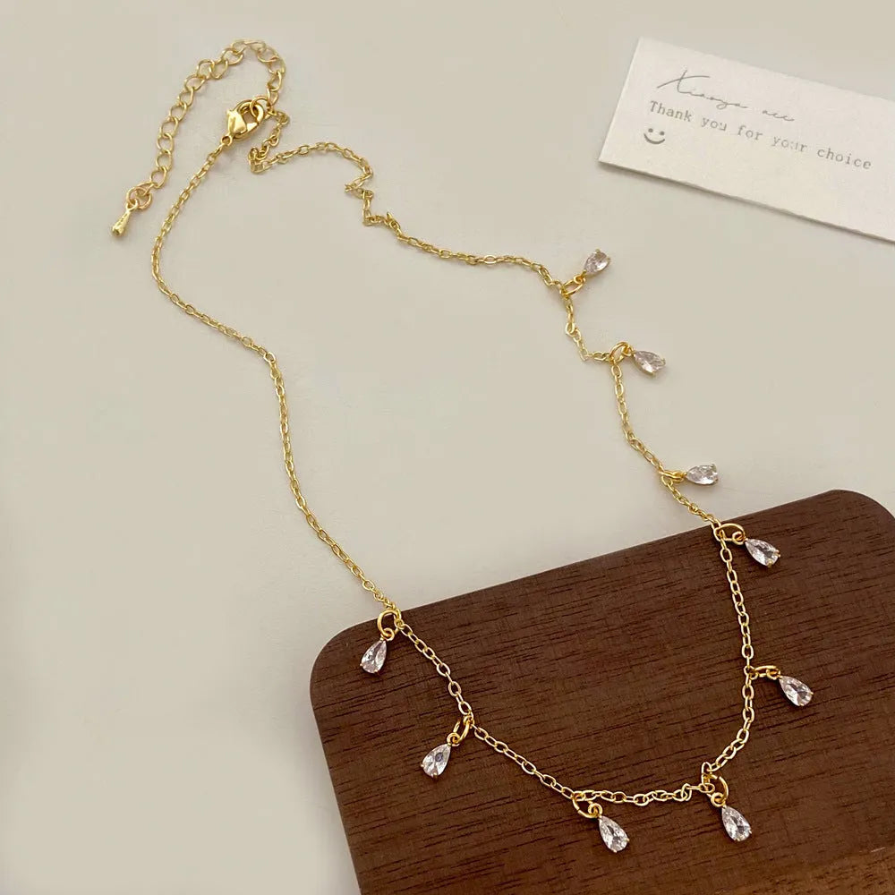 Women's zircon jewellery set with geometric necklace, earrings and anklet in meteor shower design