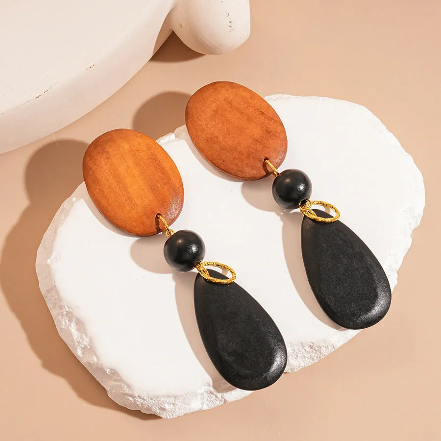 Manual wooden retro earrings with ellipse design in silver brown black colour