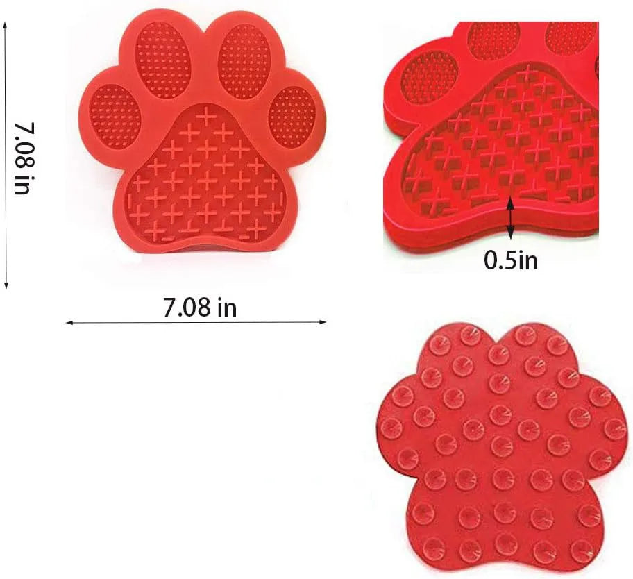 Blue silicone dog licking mat with bone texture and suction cups on a white bathroom tile.