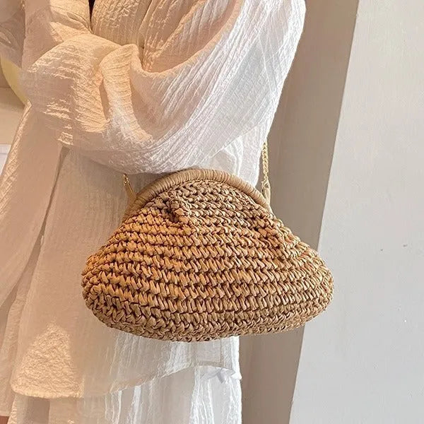 Shell-shaped women's straw bag with chain strap in khaki colour option showing zippered pocket detail