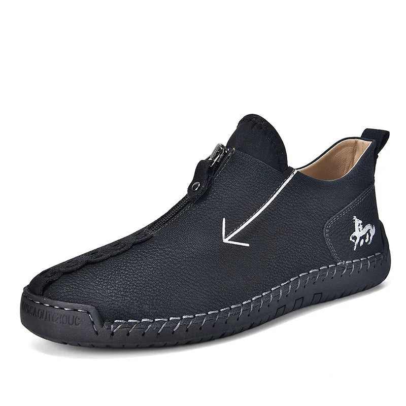 Men's black zip-up Martin boot with round toe and low heel on a white background.