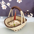 Natural straw hand-woven rustic retro basket in coffee brown, measuring 19cm by 12cm.