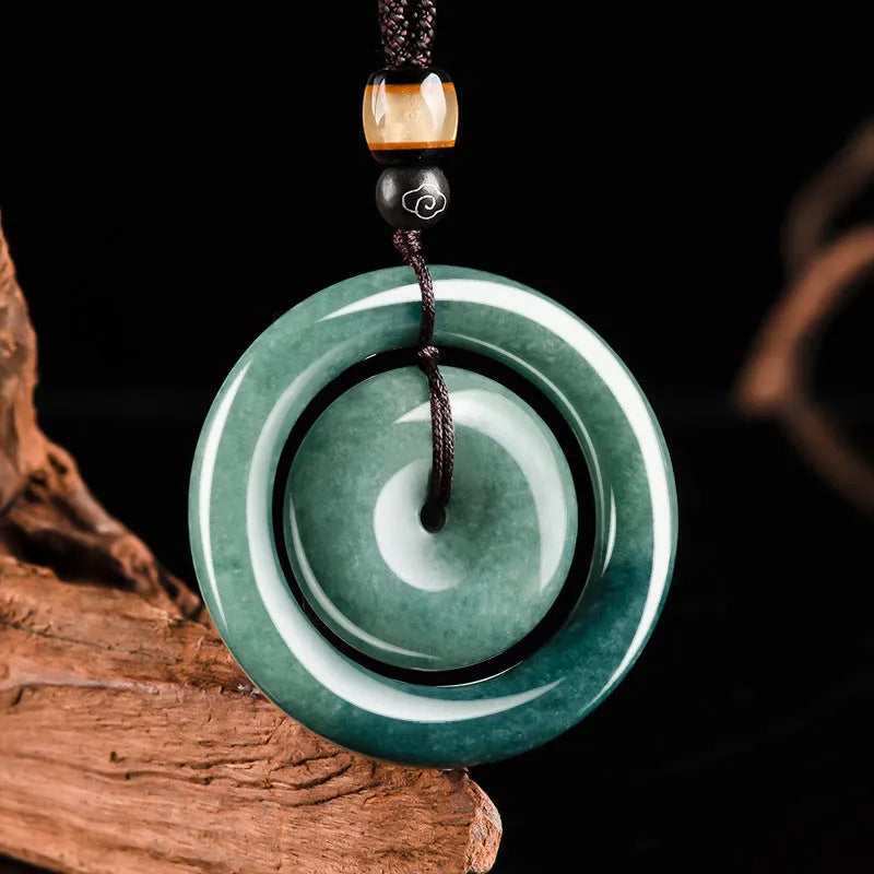 Emerald green carved jade pendant on necklace 21g