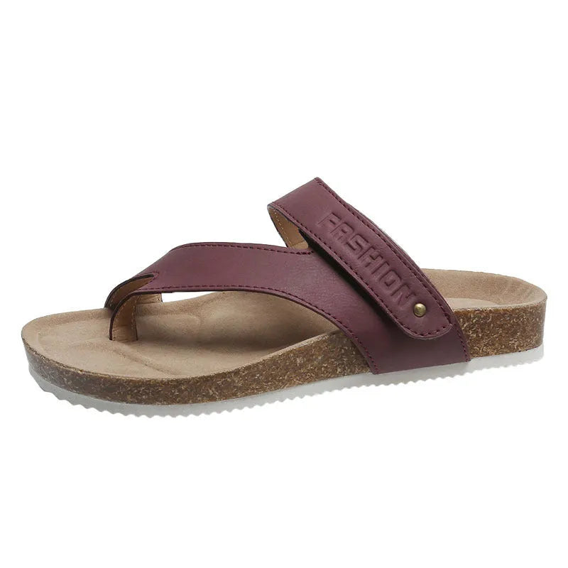 Flat toe ring thick-soled flip-flops in a solid colour on a light background