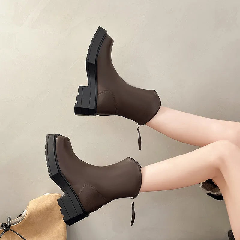 Black platform Martin ankle boots for women with a square toe and back zipper.