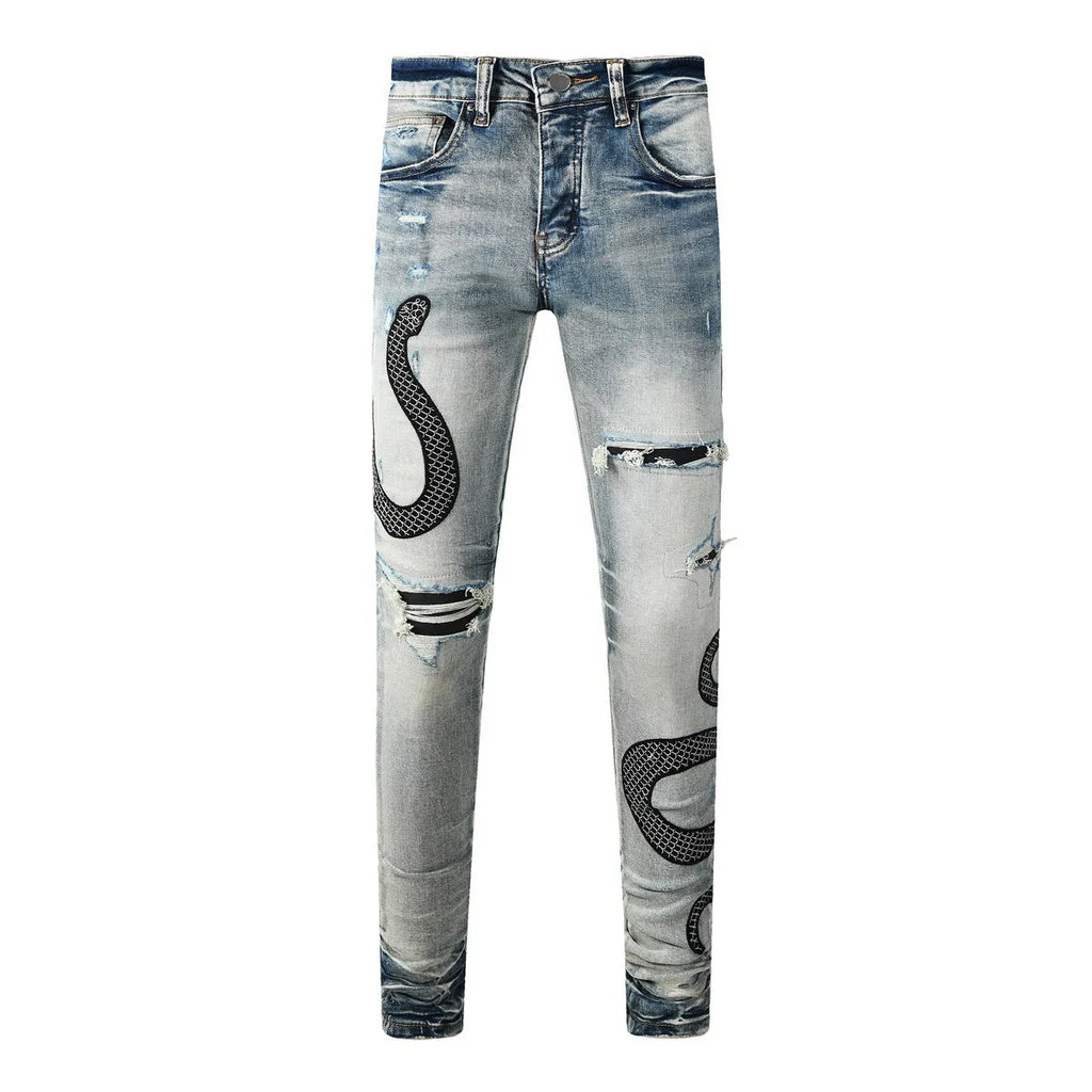 Men's blue distressed skinny jeans with a retro wash, showing a tight leg fit and button fly detail.