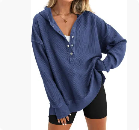 Women's loose raglan sleeve pullover sweater in peacock green colour, laid flat.