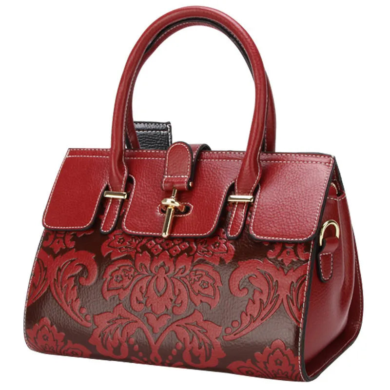 Oval vintage embossed genuine leather crossbody bag showing internal compartments