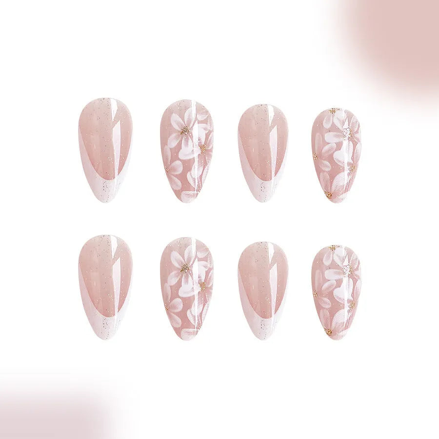 Short almond French style press-on nails with glitter flower decoration in colour C625