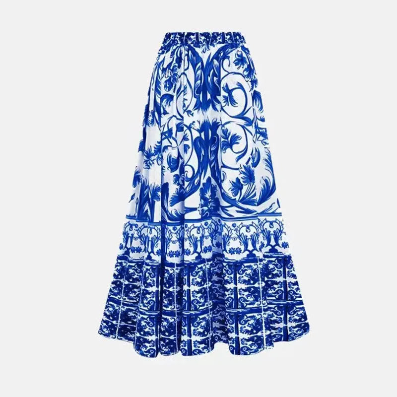 Women's printed one-piece swimsuit with a matching skirt cover-up in a rose pink floral pattern.
