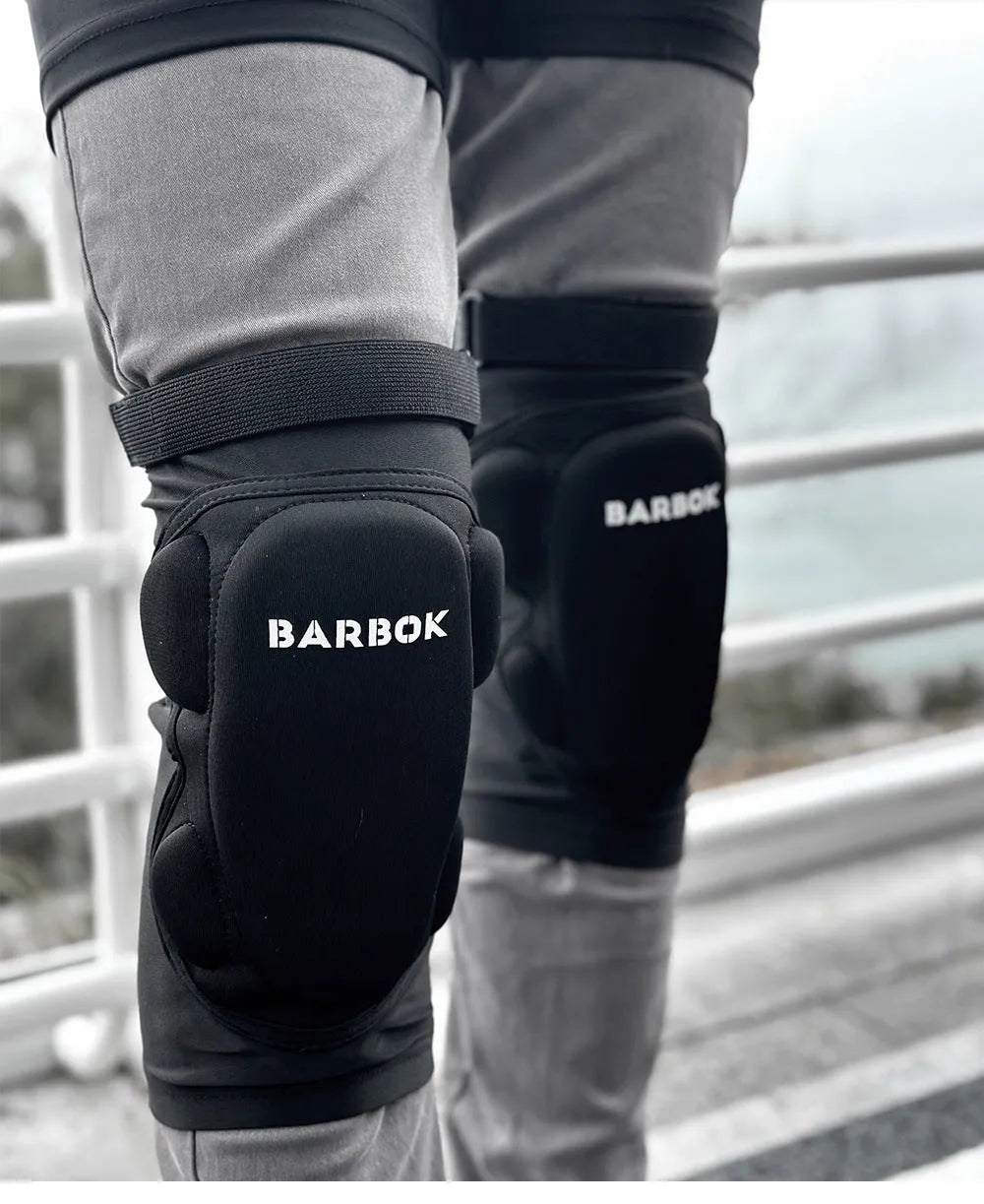 Black protective spandex trousers with integrated hip pads for skating and skateboard fall protection.