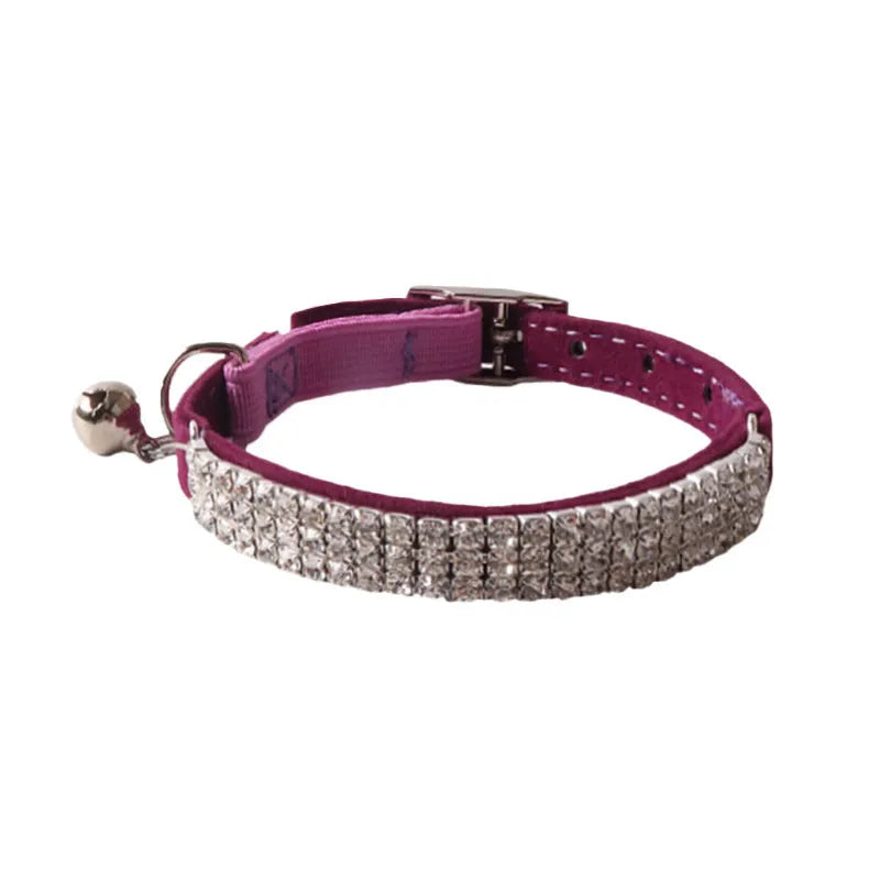 Colourful flocking fabric cat collar with elastic buckle shown in pink, black, and blue options