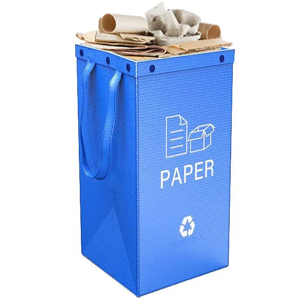 A blue 40-litre waterproof handbag-style rubbish bin made from PP plastic, shown beside furniture.