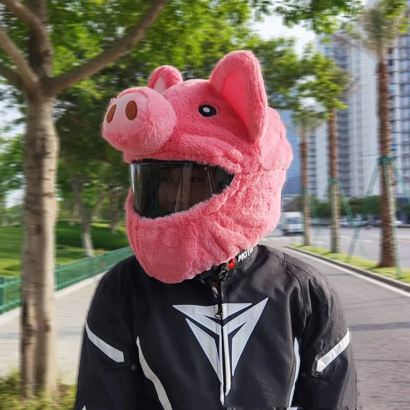 Pink plush cartoon-style protective hood for helmets on a white background.