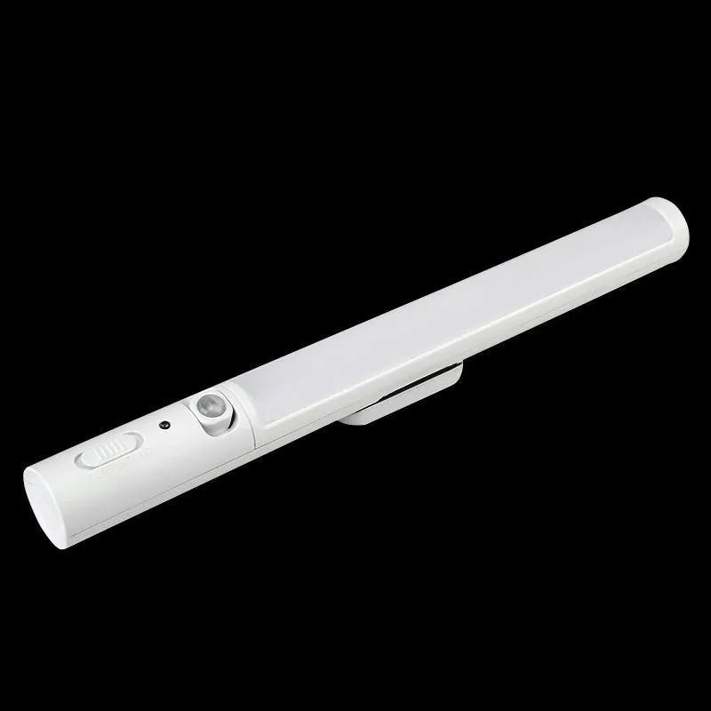 Slim white human body induction LED cabinet light with magnetic strip on back for mounting