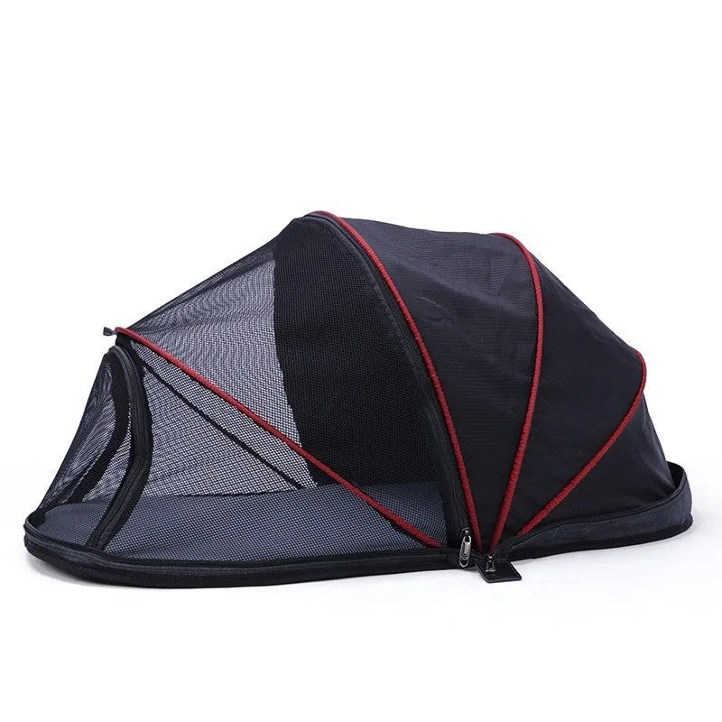 Black half mesh cat folding tent folded for storage with mesh ventilation panels visible