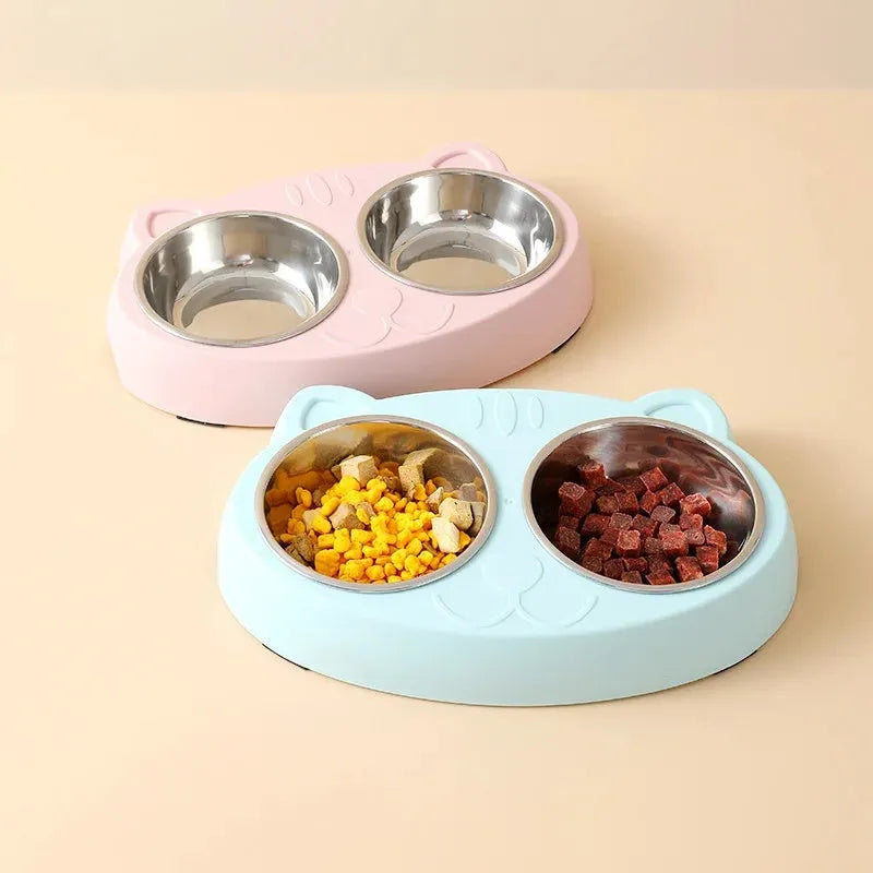 Blue macaron-shaped plastic pet feeding tray with two bowls for cats and small dogs on a white surface
