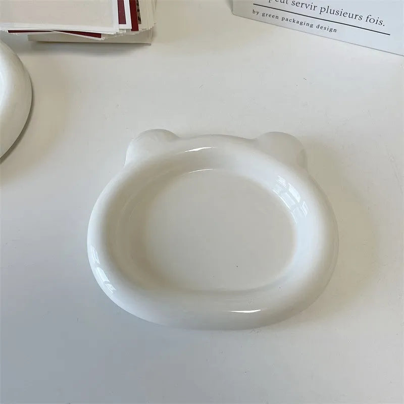 White porcelain plate with bear doodle or round doodle design, shown in 15cm and 20cm sizes.