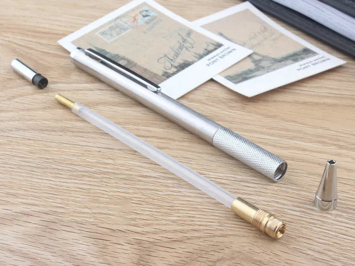 Metal automatic mechanical pencil shown with selection of compatible lead sizes including 0.5mm and 2.0mm.