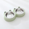 Stainless steel frog-shaped double bowl for pet food and water in blue, green, or pink.