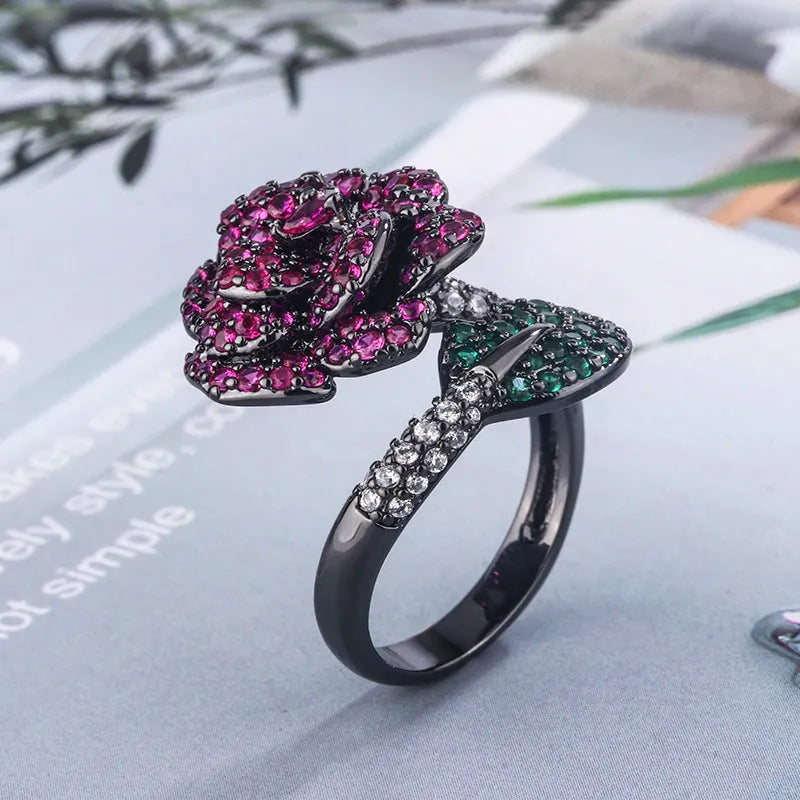 Gold-plated black gold ring with simulation red corundum stone and geometric flower design