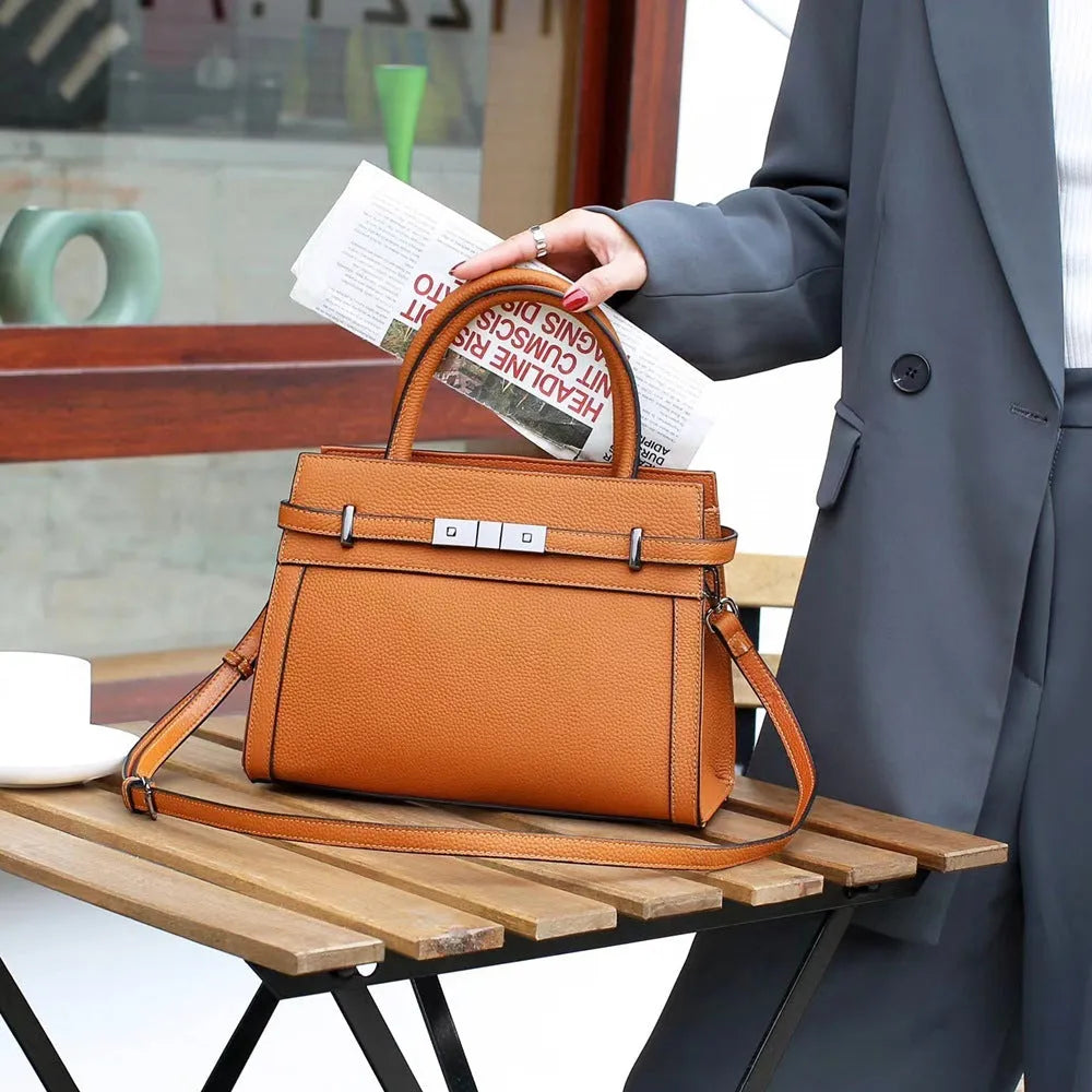 Small square genuine leather shoulder bag in almond green with sandwich pocket exterior