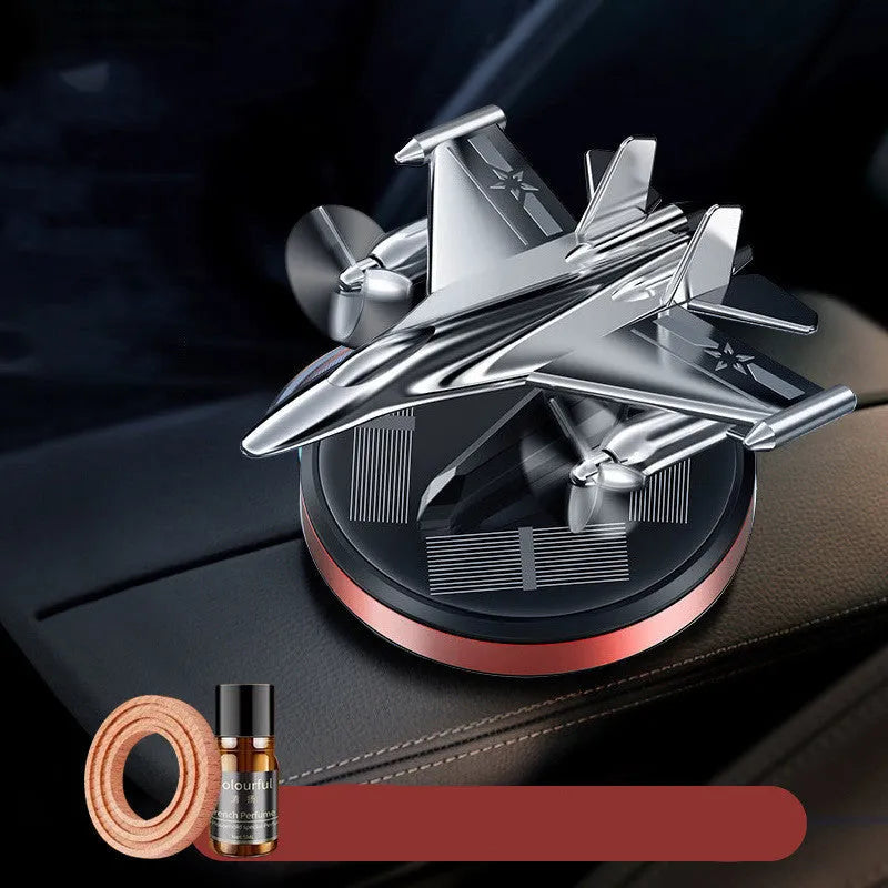 Solar powered rotating silver fighter jet perfume ornament with aluminium alloy seat and essential oil.