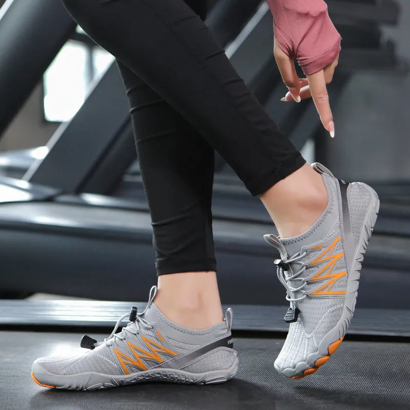 Indoor fitness training sneakers in multiple colours with striped pattern and rubber sole.