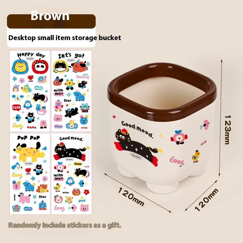 Red and brown cartoon-style desktop storage organiser with grid pattern and sticker set for labelling.