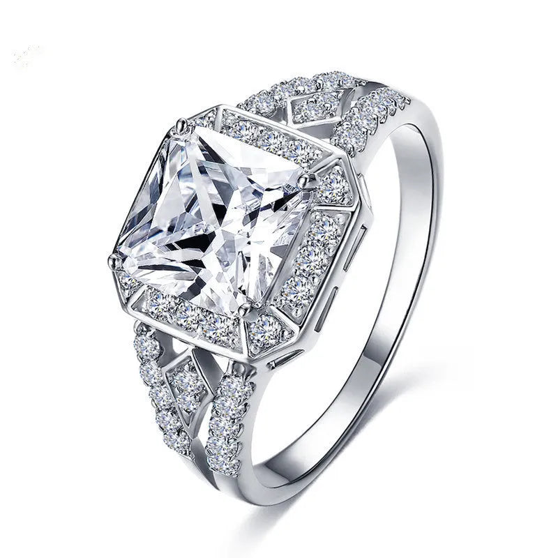 Geometric platinum colour zircon ring with quadrilateral design and hollow ornament construction