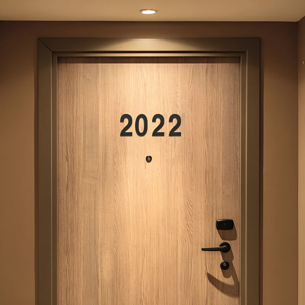 Black stainless steel sticky house number sign with 7.5cm characters and adhesive backing