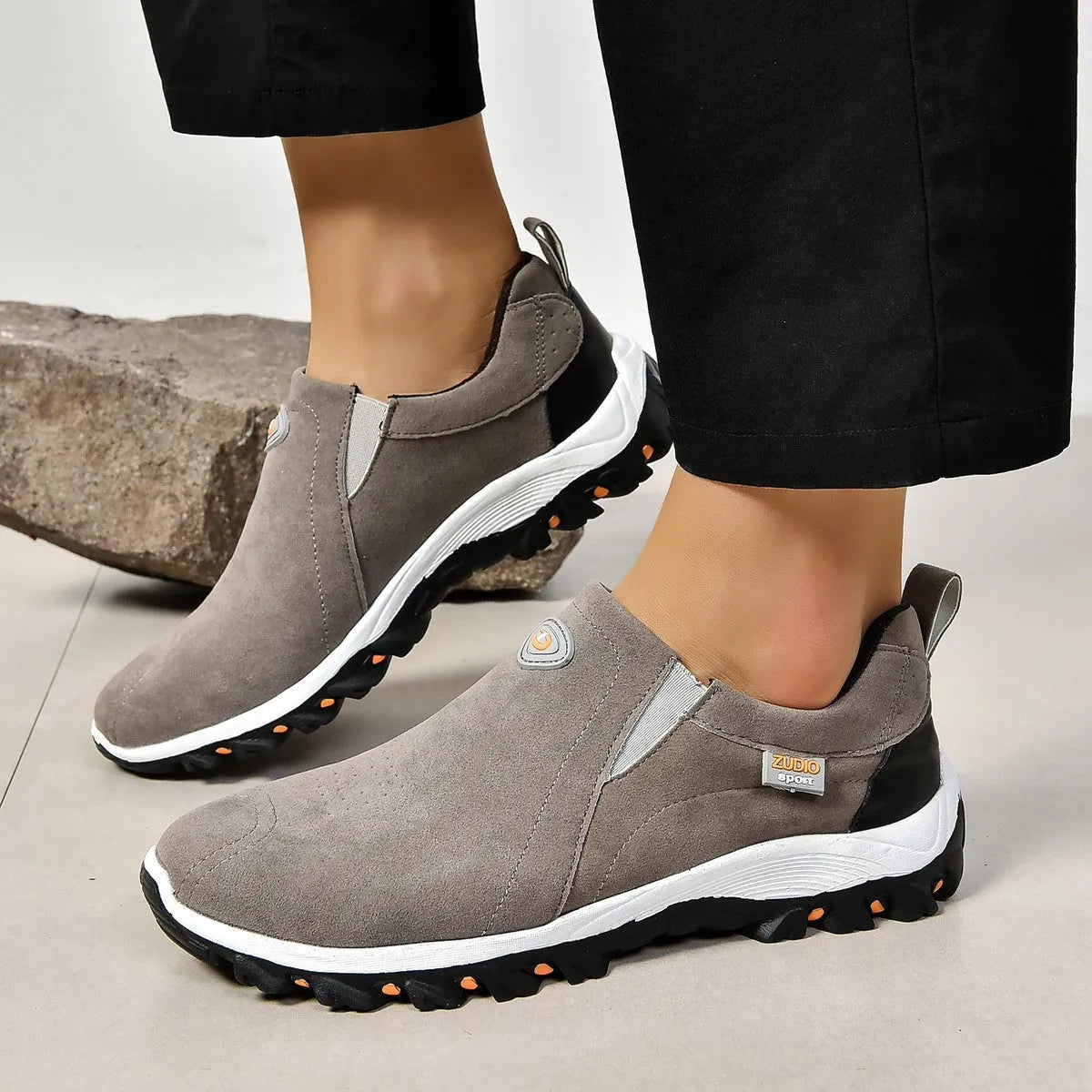 Men's thin slip-on overshoe covers in grey, blue, light brown, green, and black colours on a rubber sole.