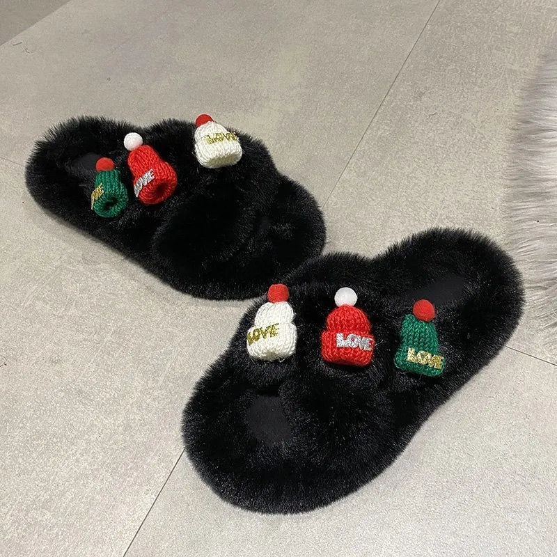 Women's black Christmas slippers with Santa hat decoration on plush faux fur upper.