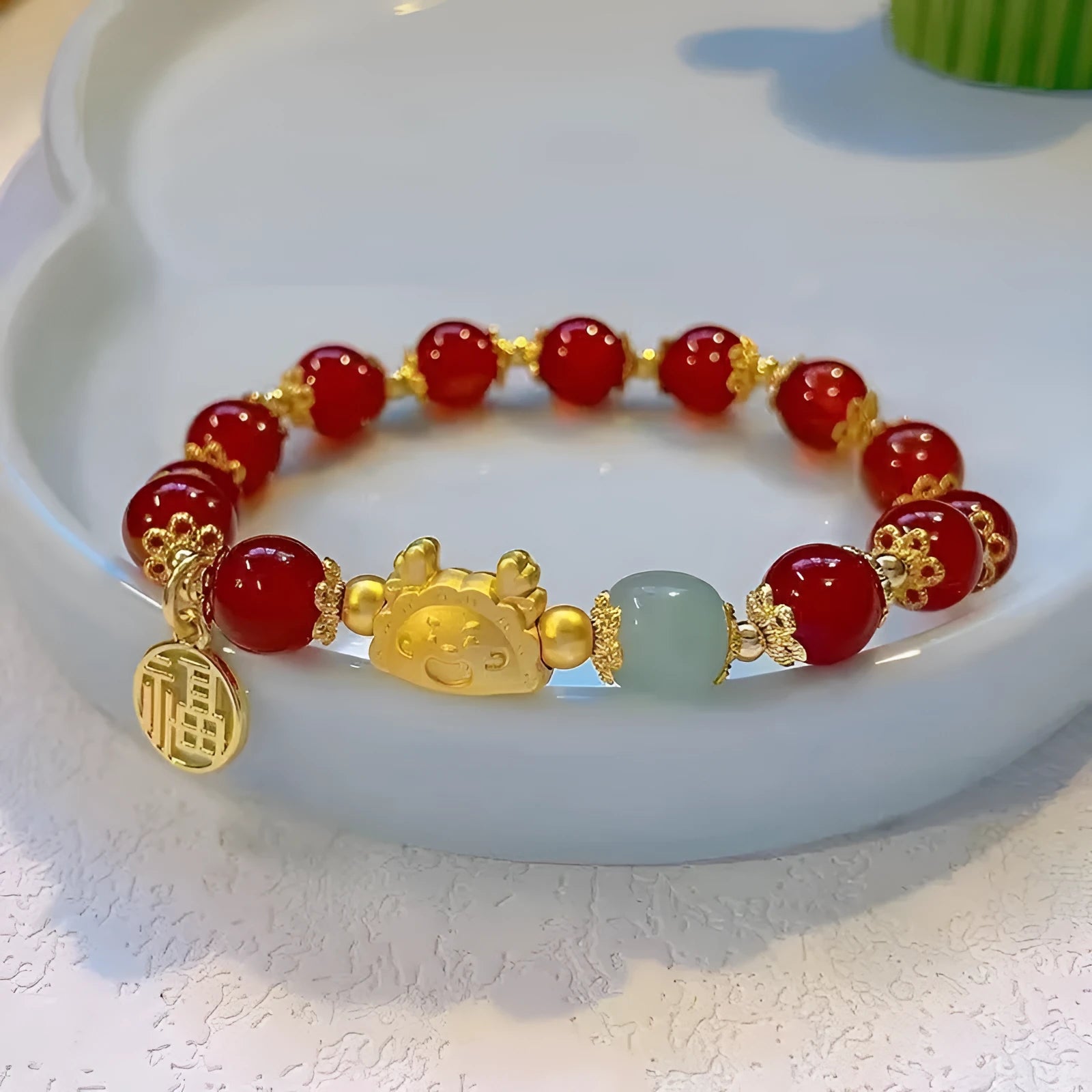 Glass floral glazed bracelet with zodiac animal charm in red, pink, and white pearl bead colours