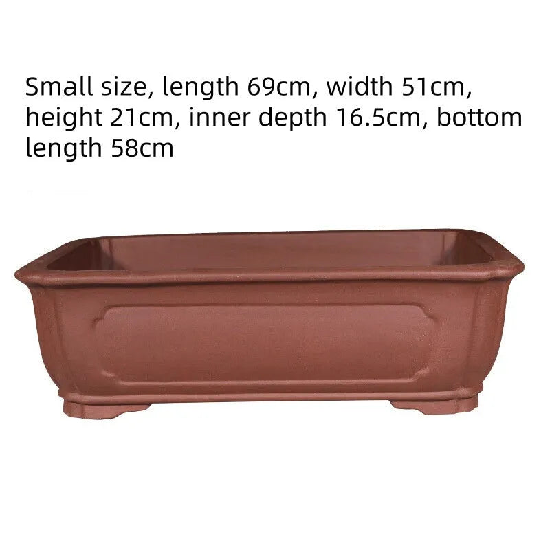 Large rectangular purple clay flowerpot showing handmade texture and substantial rectangular shape