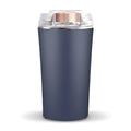 Blue mini electric grain and spice grinder with stainless steel blade on a kitchen worktop