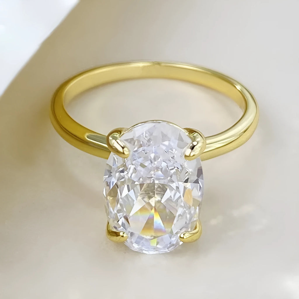 Oval 6x9mm gemstone ring with four-claw setting in gold or silver colour