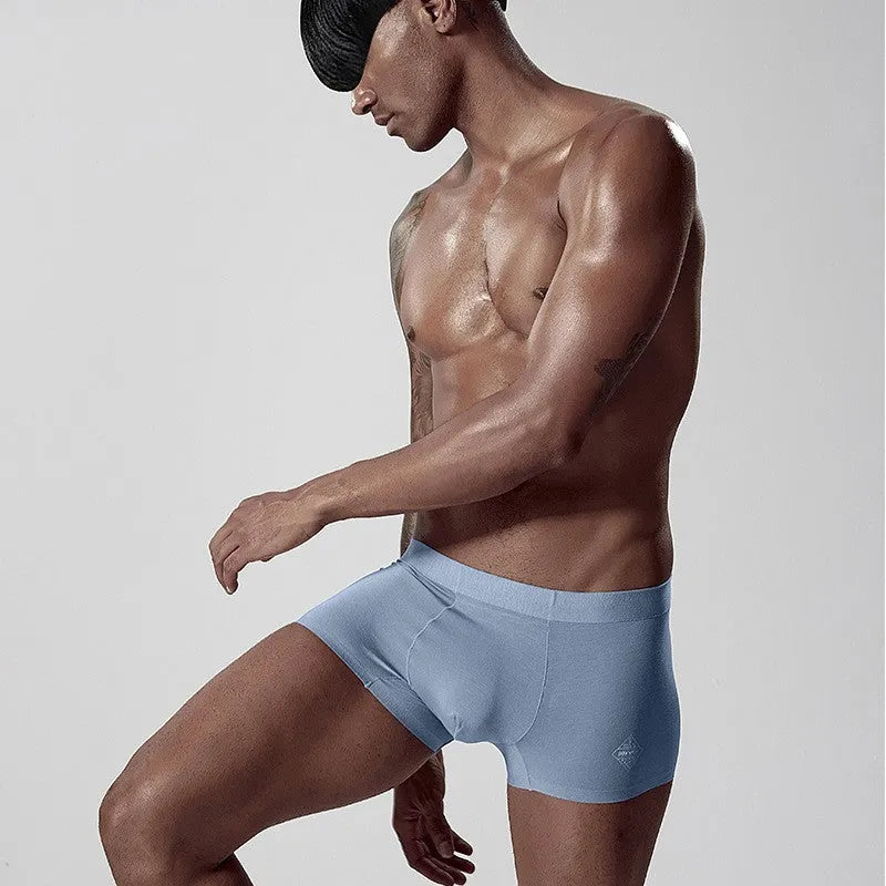 Seamless solid green modal men's mid-waist briefs for body shaping