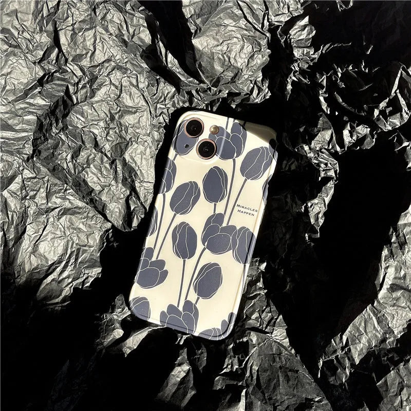 Black silicone phone case with a tulip floral pattern for iPhone.