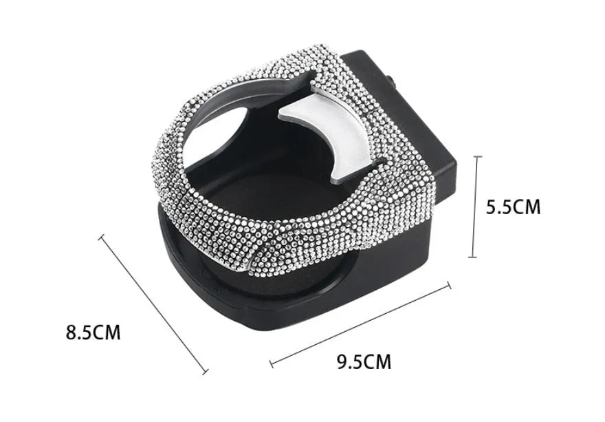 White diamond decorated ABS plastic car vent cup holder mounted in a car air vent.