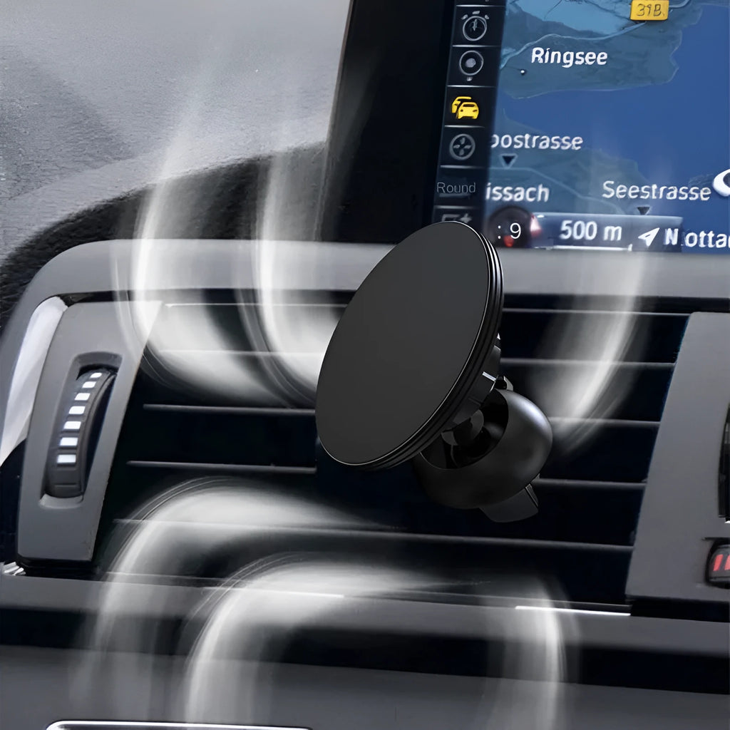 Black aluminium alloy magnetic suction car phone holder mounted on a car air vent.