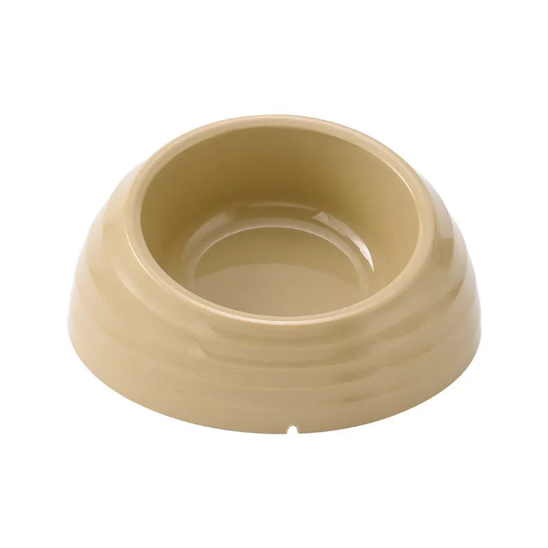 Stainless steel cat bowl with plastic base in beige, brown, or light green.