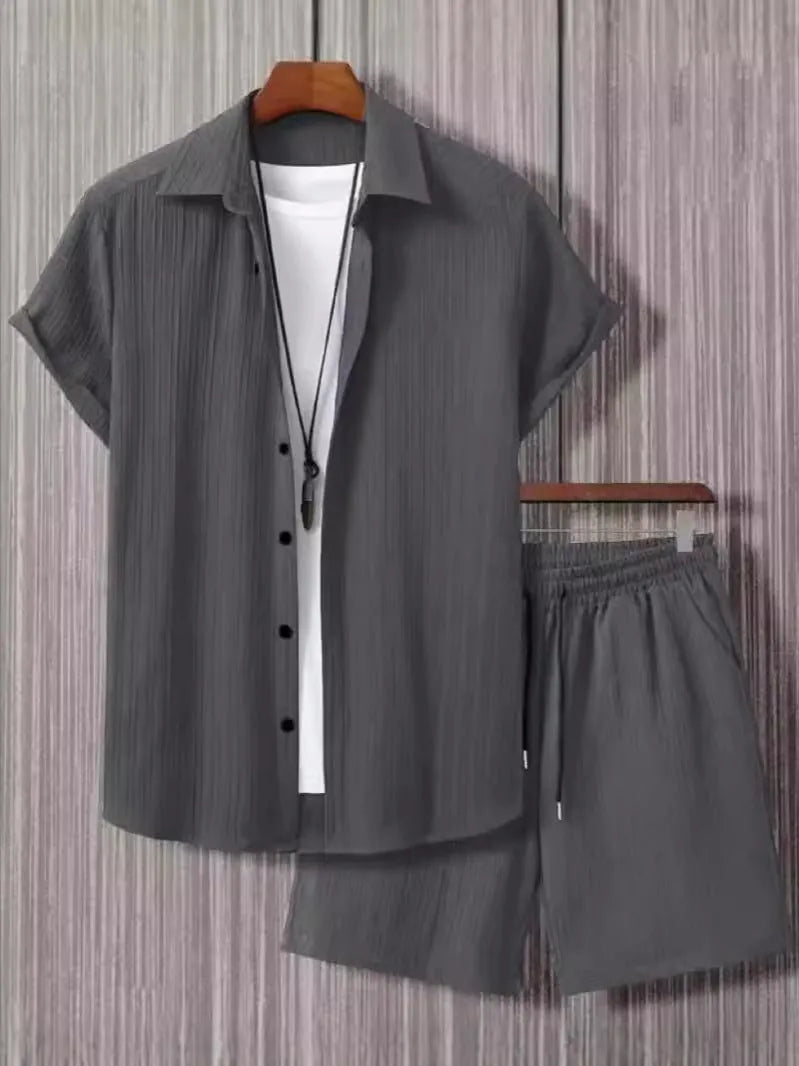 Men's jacquard short sleeve suit set in black with matching shorts, showing front view
