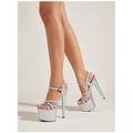 Women's black high heel sandals with buckle strap and hollow-out stiletto design