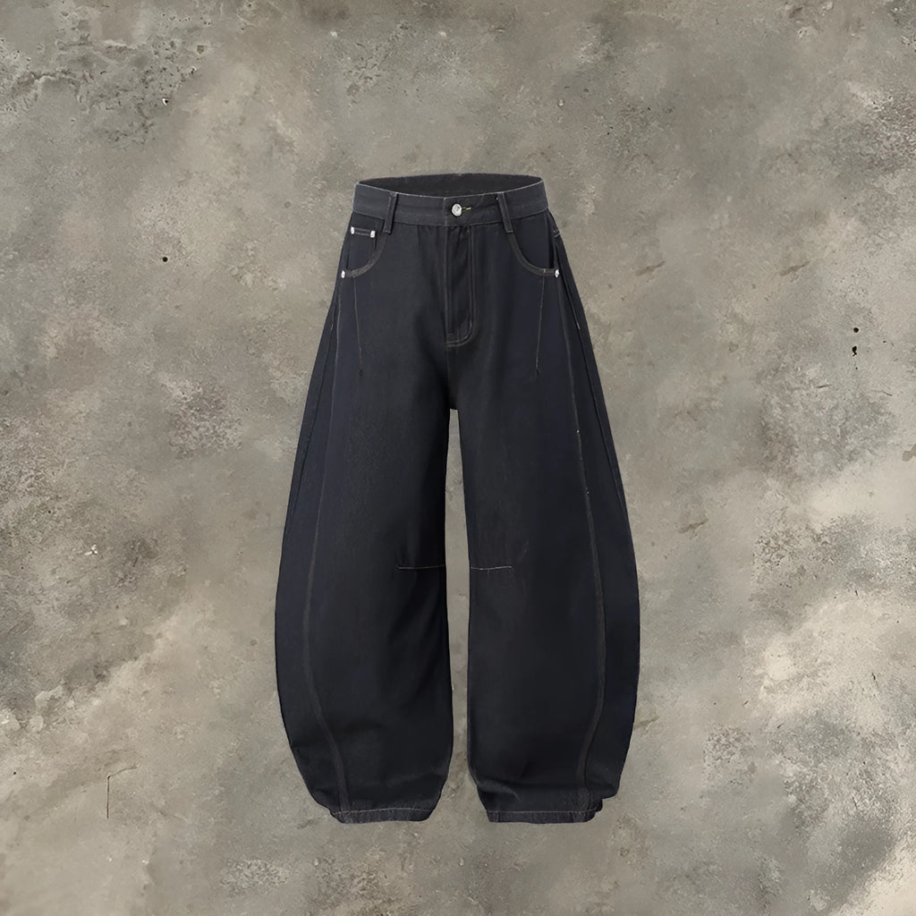 Men's original cow coloured wide leg denim trousers with a mid waist, laid flat.