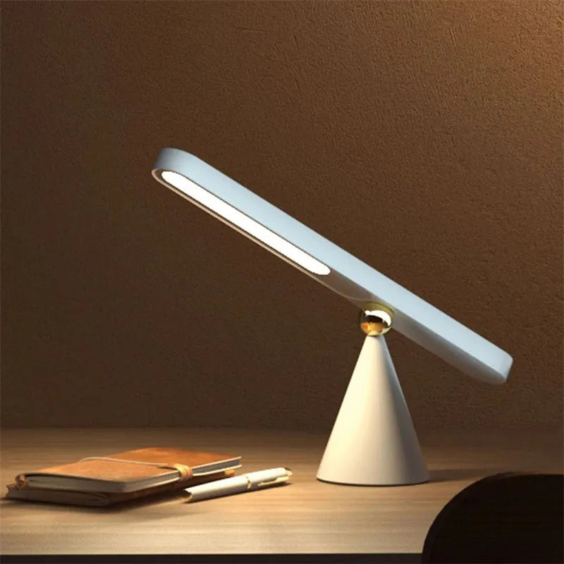 Geometric desk lamp with magnetic base in white or khaki colour