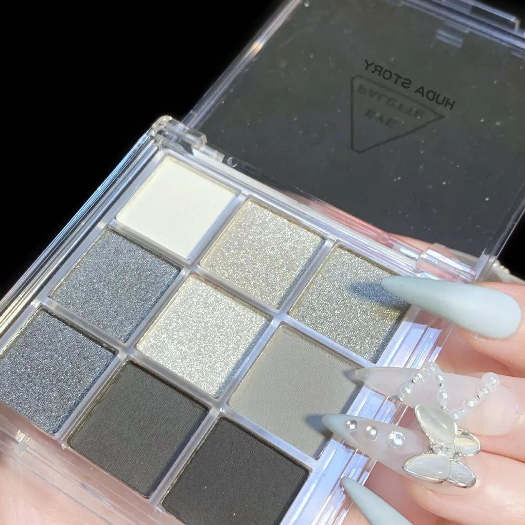 Smoked nine-colour eye shadow palette showing white, silver, black, and iron grey shades
