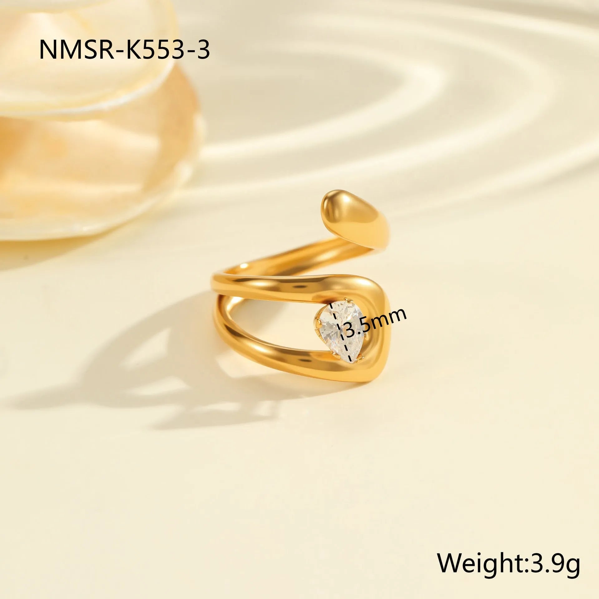 Women's geometric zircon ring with adjustable open mouth design on a hand.
