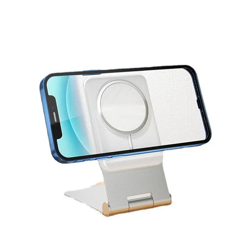 Silver aluminium alloy wireless charging stand holding a phone upright on a desk