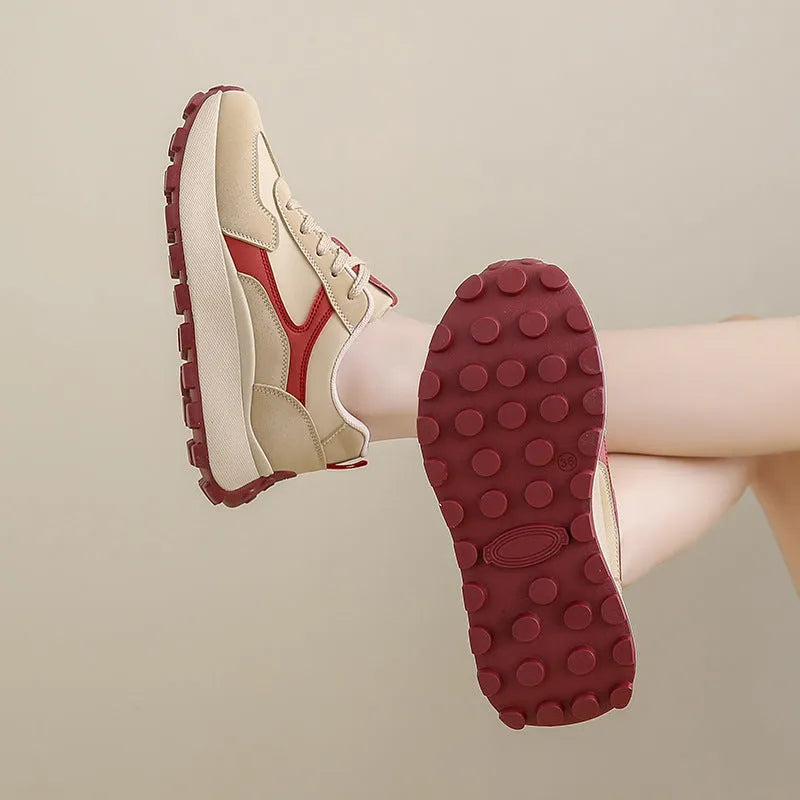 Women's low-top sports running shoes with mesh lining and front lace-up closure in solid colour options